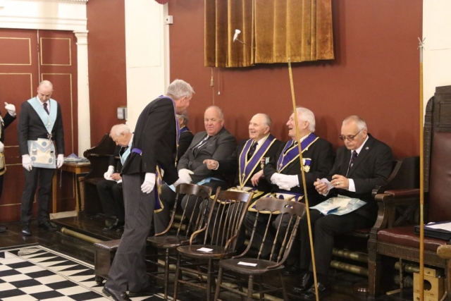 Group of freemasons chatting in lodge